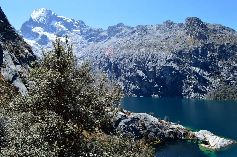 Laguna Churup below Churup peak under a blue sky