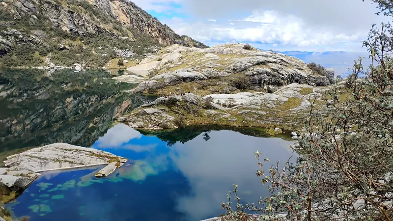 Laguna Churup among rocks, with reflections on the water