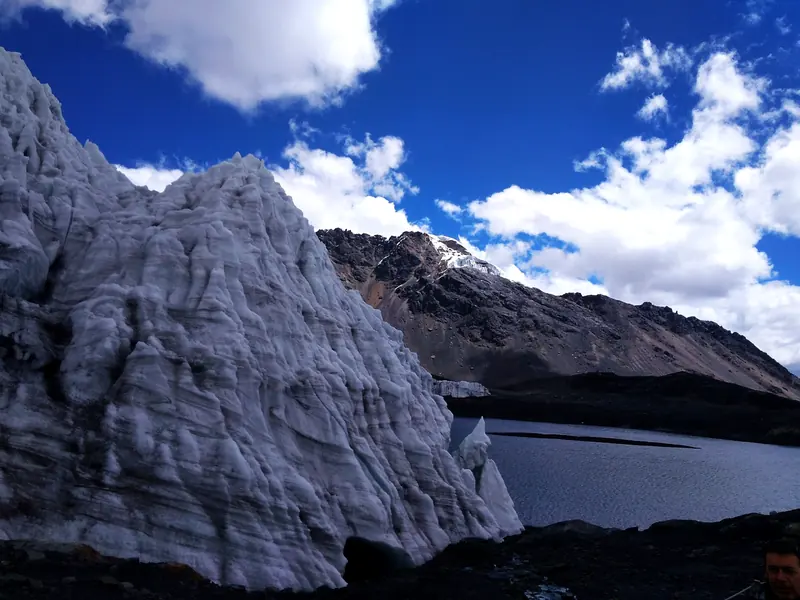 Pastoruri glacier under a blue sky with clouds