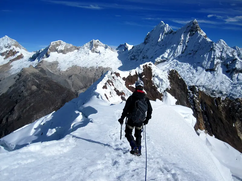 A mountaineer on the summit ridge of Yanapaccha, Cordillera Blanca